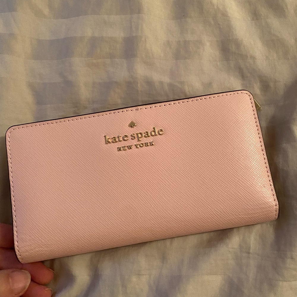 Kate Spade, Large slim bifold leather wallet. New with tags, chalk pink color.